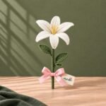 Ivory Whisper handmade white crochet lily single stem with pink ribbon by Ayzalo