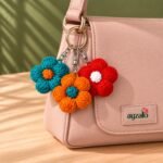 Multicolor Daisy crochet flower keychain in a lifestyle setting