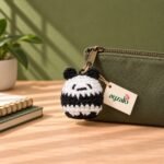Chubby Panda crochet keychain in a lifestyle setting