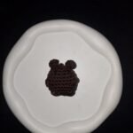 Small brown crochet bear charm with rounded ears