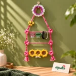 Bloom Ladder hair accessory organizer with pink braided frame, floral accents, clips, headbands and sunflower details by Ayzalo