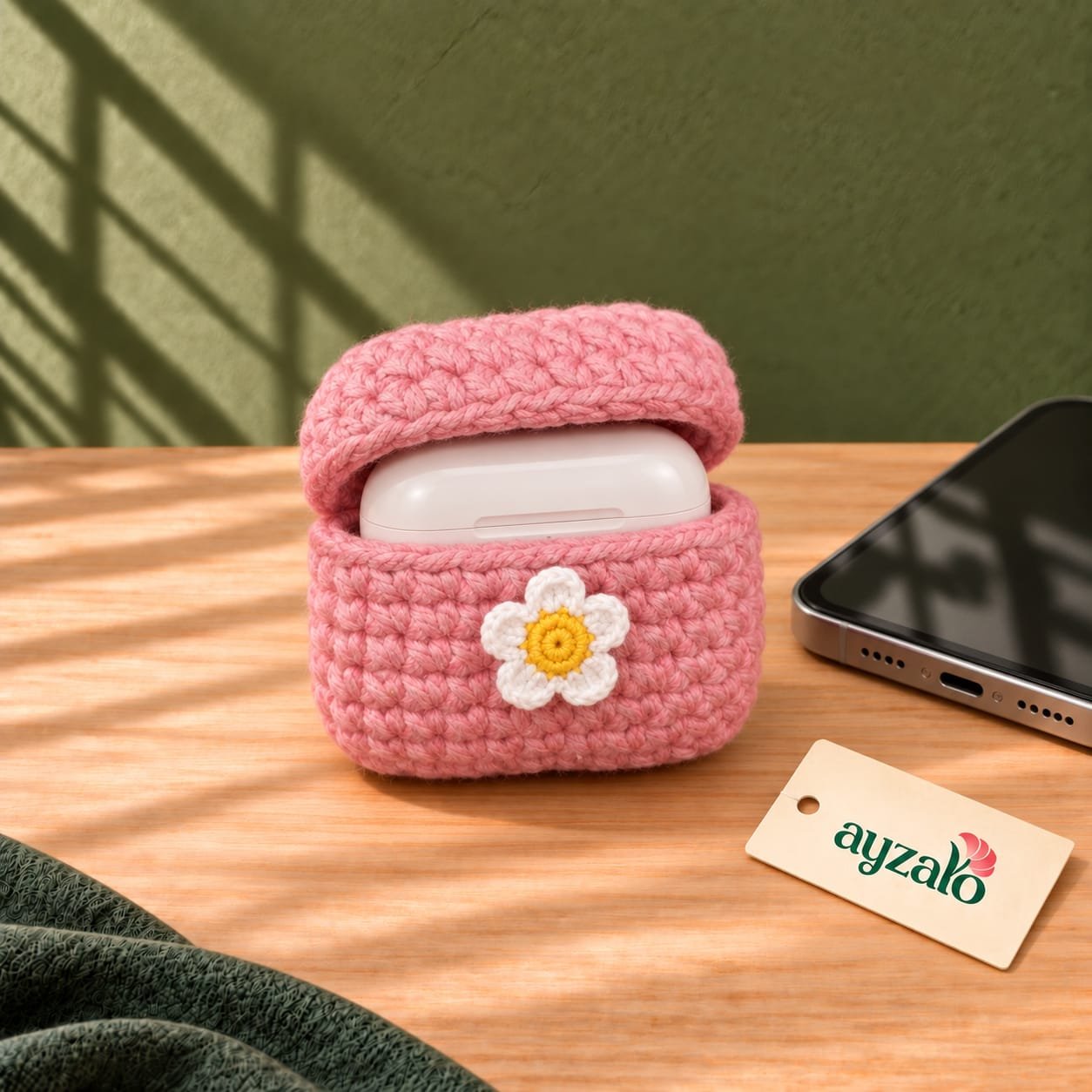Pink Daisy Earpods crochet cover by Ayzalo with open wireless earbuds case