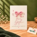 It's a Girl handmade pink crochet bow card with floral accents and newborn baby girl message by Ayzalo