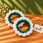 Pair of Ayzalo jasmine crochet gajra bangles with green wrapped bases and white scalloped petals