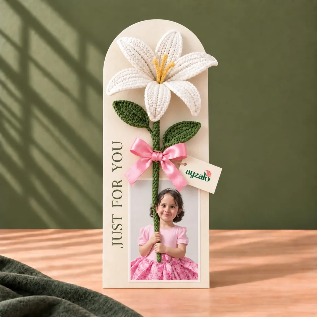 Personalized Ayzalo flower photo card with a white crochet lily, green leaves, pink ribbon and custom photo cutout