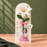 Personalized Ayzalo flower photo card with a white crochet lily, green leaves, pink ribbon and custom photo cutout