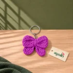 Purple crochet bow keychain and bag charm with silver-tone keyring by Ayzalo