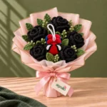 Spidermen Charm Bouquet Pakistan with black crochet roses, green leaves and red-blue spider charm by Ayzalo