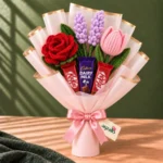 Sweet Surrender Crochet and Treat Bouquet with red crochet rose, purple lavender, pink tulip, KitKat and Cadbury Dairy Milk chocolates by Ayzalo